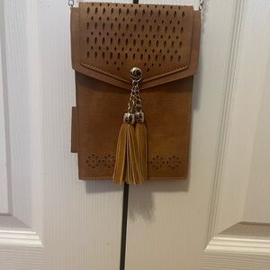 Elegant Tan Crossbody Bag with Tassel Accents